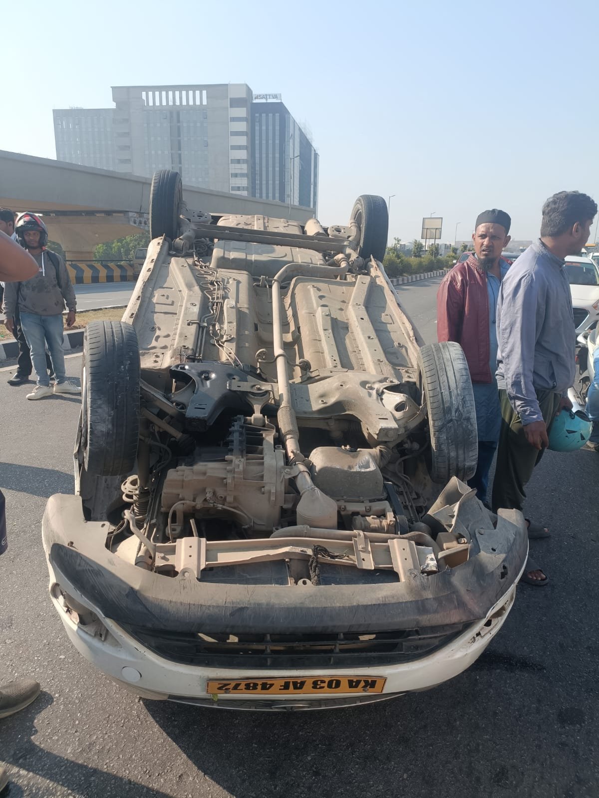 Car found toppled on Bagalur flyover  