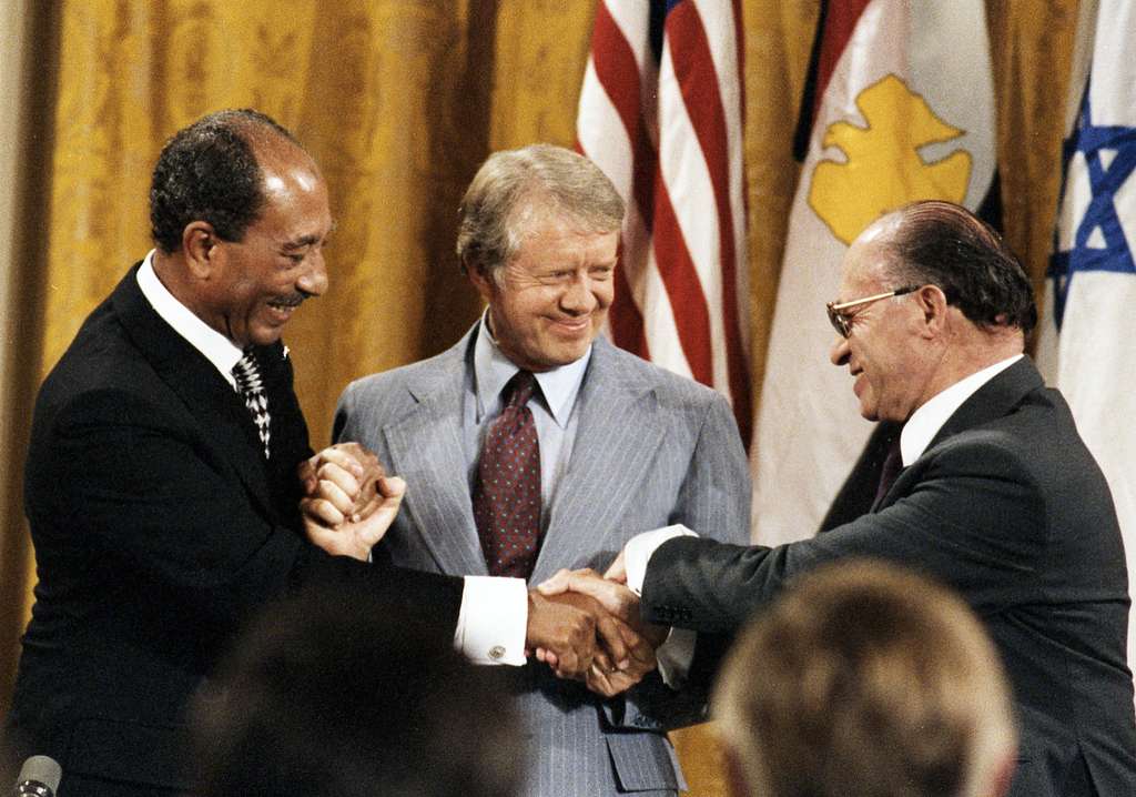 Egyptian President Anwar Sadat (L), US President Jimmy Carter (C) and Israeli Prime Minister Menachem Begin, at the signing of the Camp David Accords, September 17, 1978.