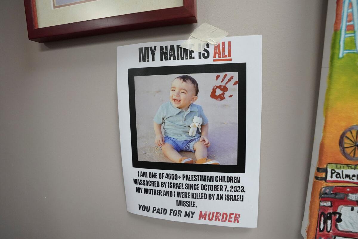 A sign placed by supporters of Palestinian rights, calling for a ceasefire and end to the siege in Gaza, is seen in the constituent office of Canada's Deputy Prime Minister and Finance Minister Chrystia Freeland in Toronto, Ontario.