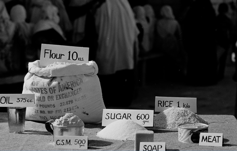 Rationed food being distributed to Palestinians in a refugee camp in East Jordan, undated.