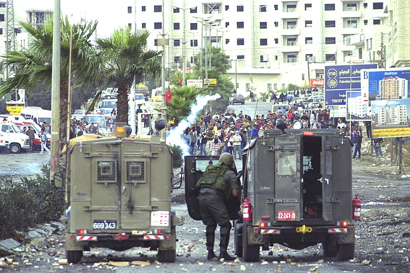 Palestinian rioters confront Israeli security forces, at Ayosh Junction, near Ramallah, in the West Bank, October 2000.