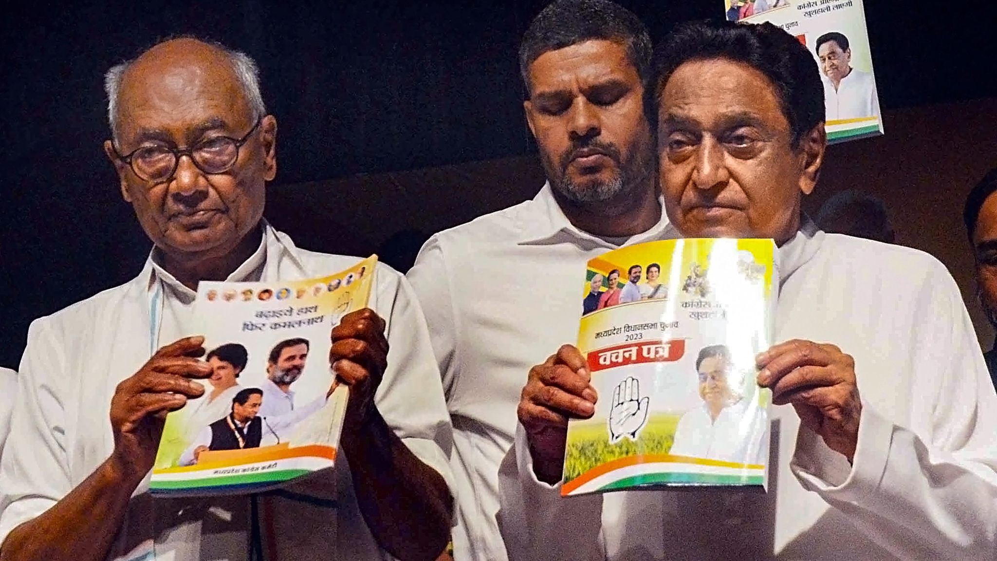Madhya Pradesh Congress President Kamal Nath with party leader Digvijaya Singh and others releases the party's 'Vachan Patra' (manifesto) for the upcoming State Assembly elections, in Bhopal.