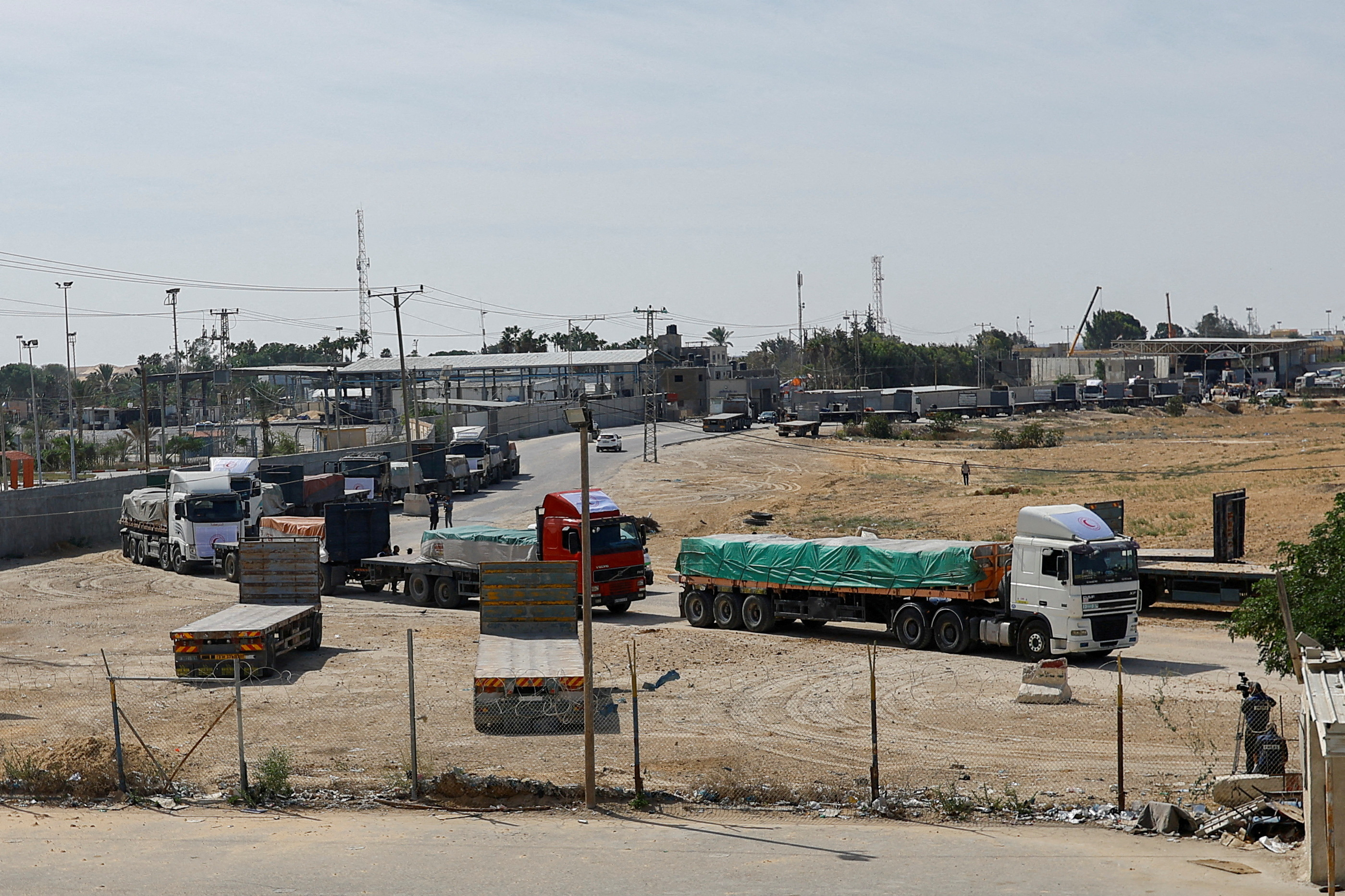 File Photo: Trucks carrying aid wait to exit, on the Palestinian side of the border with Egypt, as the conflict between Israel and Palestinian Islamist group Hamas continues, in Rafah in the southern Gaza Strip, October 21, 2023. 