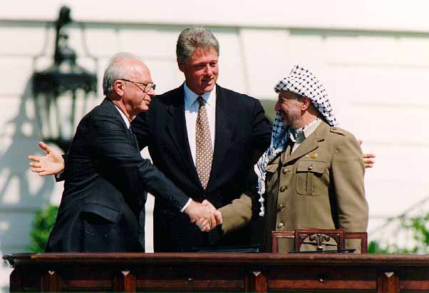Israeli Prime Minister Yitzhak Rabin (L), US President Bill Clinton (C), and PLO Chairman Yasser Arafat at the White House, during the signing of the historic Oslo Accords, 1993.