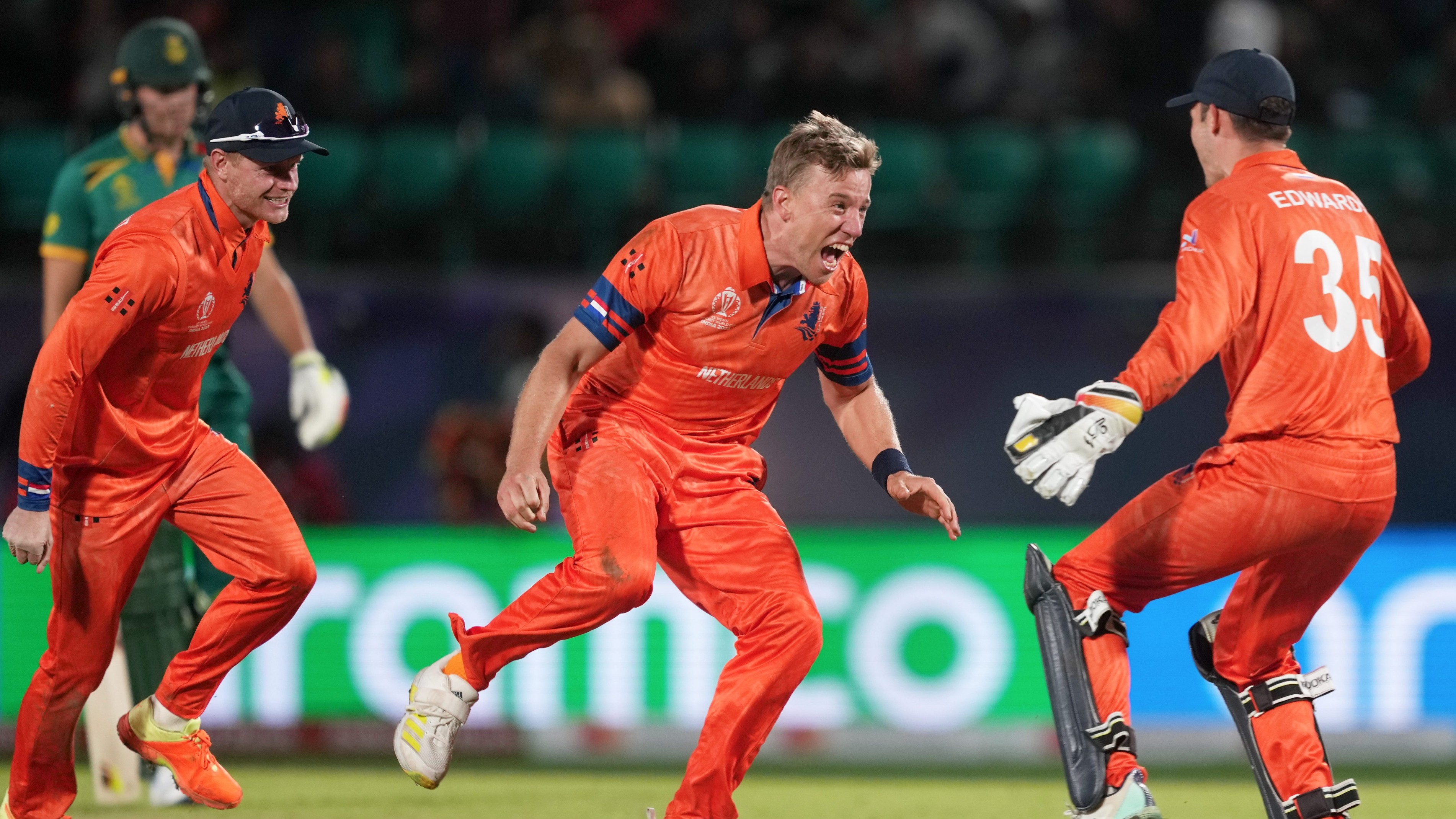 Netherlands' Logan van Beek celebrates with teammates after taking the wicket of South Africa's David Miller.