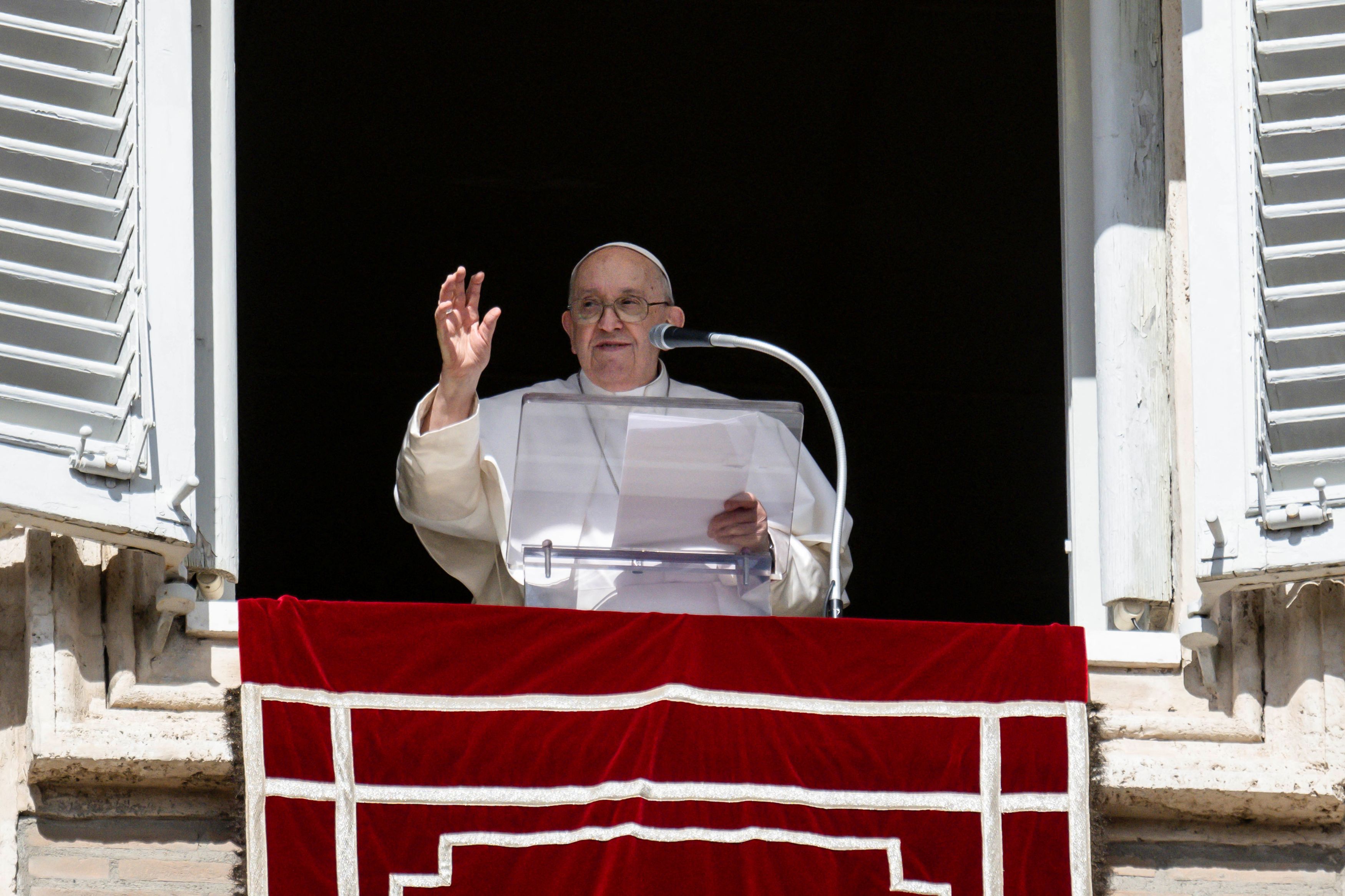 Pope Francis leads the Angelus prayer from his window at the Vatican, October 22, 2023.