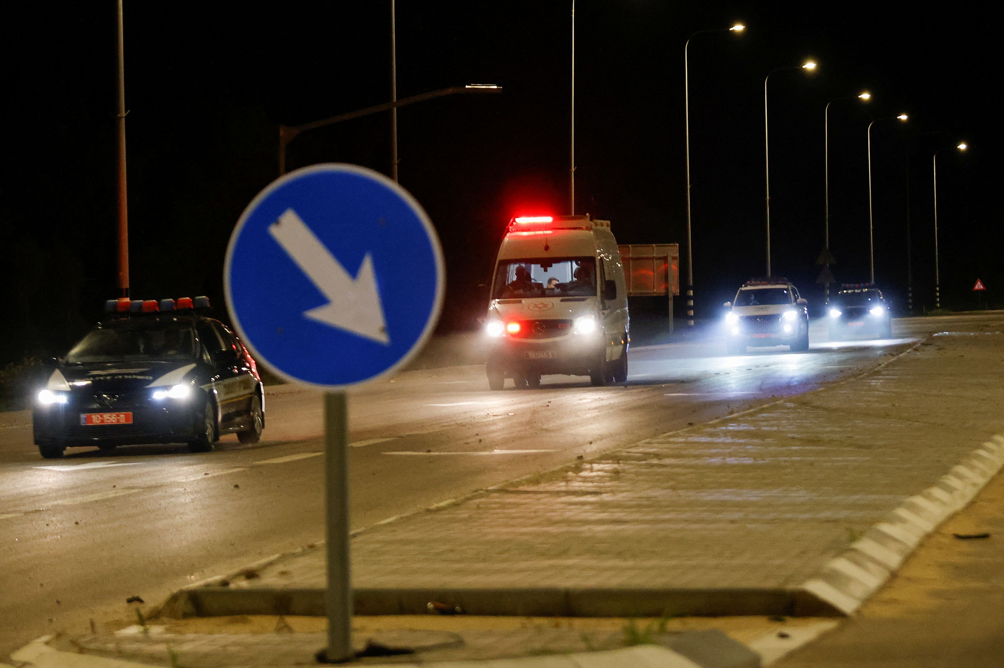 An ambulance believed to be carrying hostages released as part of a deal between Israel and Palestinian Islamist group Hamas, drives near the Israel-Gaza border, in Israel November 26, 2023. 