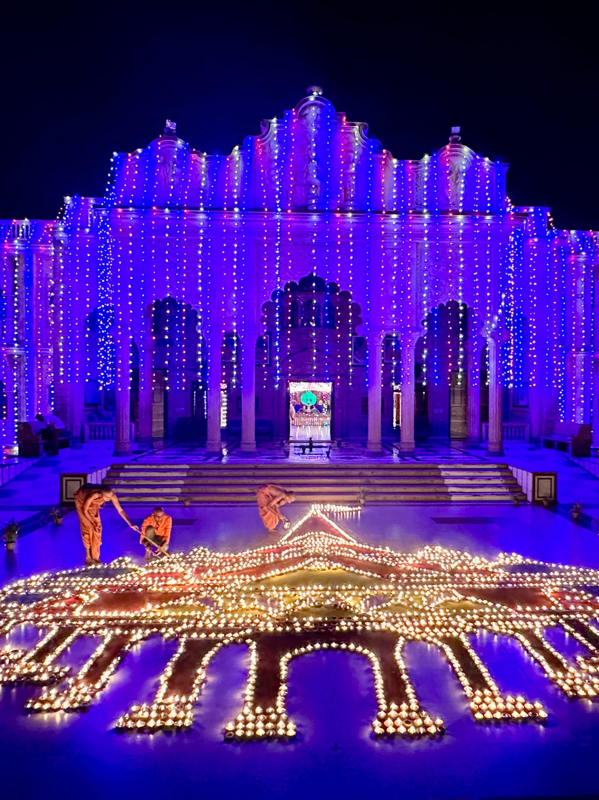 Swaminarayan saints make a formation of Ram Mandir with oil lamps on Diwali festival, in Ahmedabad.
