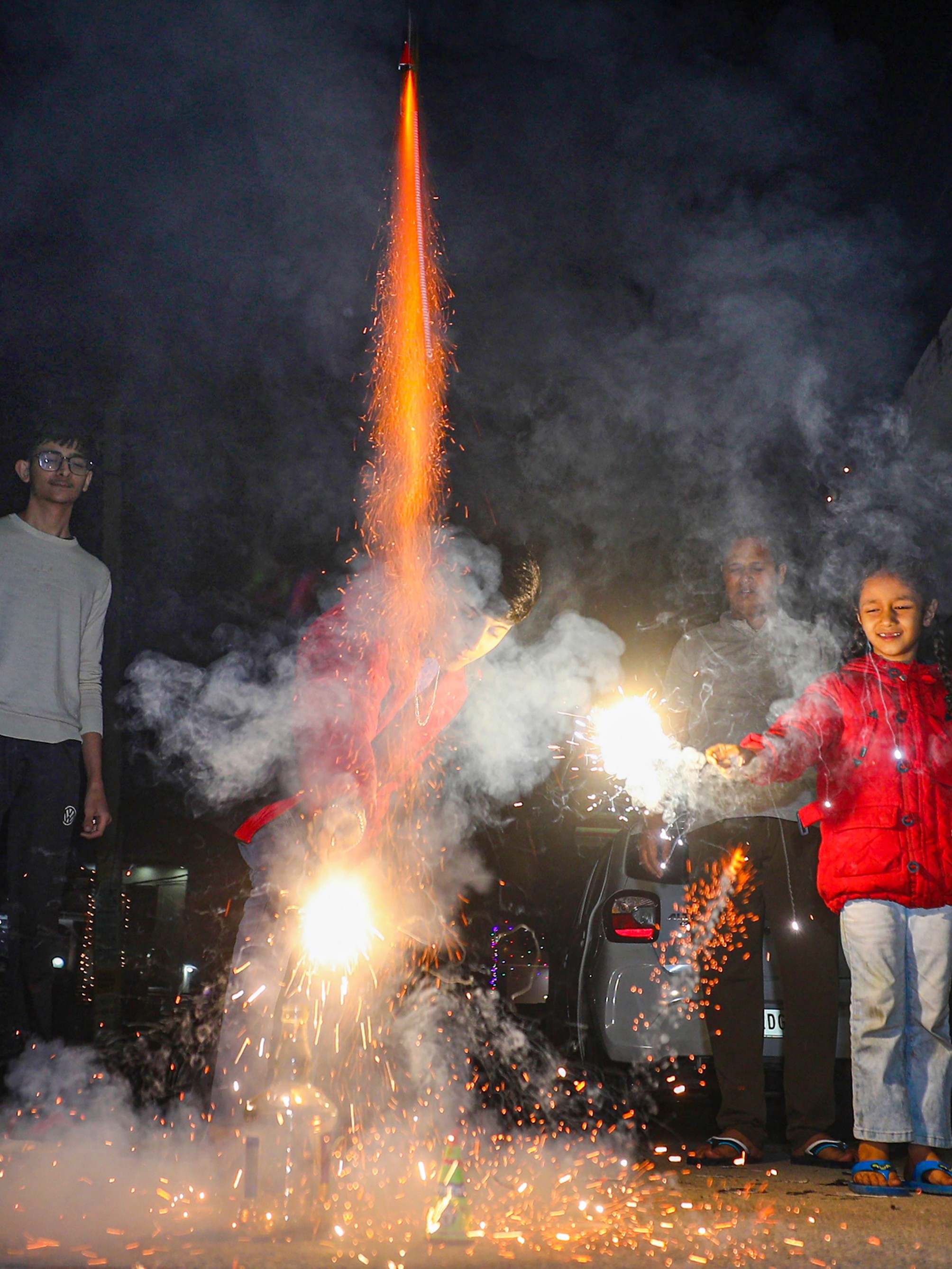 People burst firecrackers to celebrate Diwali festival, in Jammu.