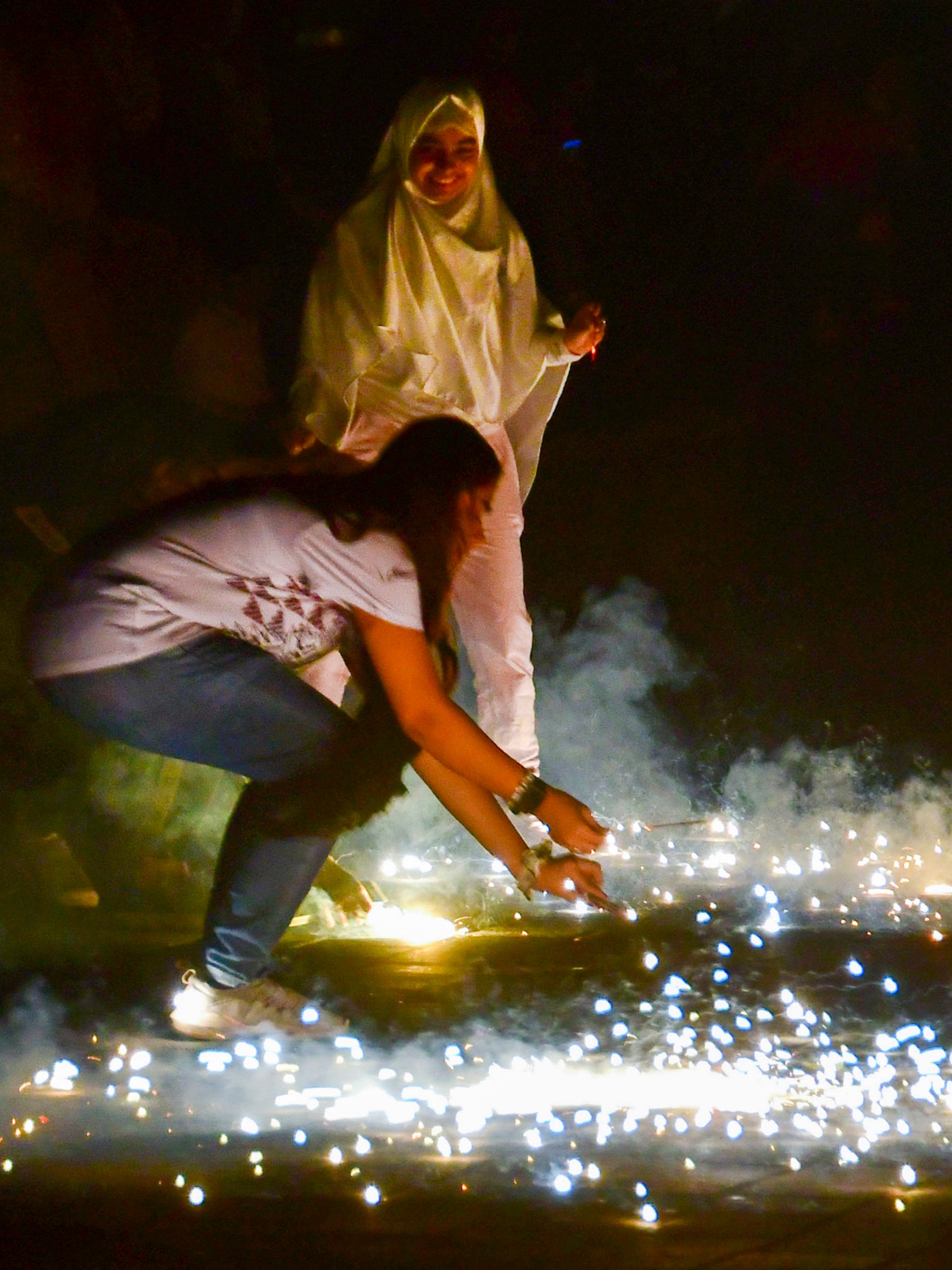 People in Mumbai burst firecrackers during the Diwali celebrations at Marine Drive.