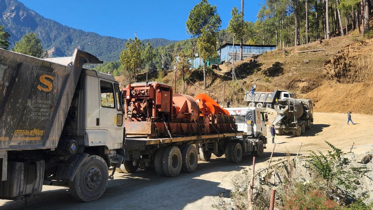 A new auger machine arrives at the site where road workers are trapped in a tunnel after a portion of it collapsed, in Uttarkashi.