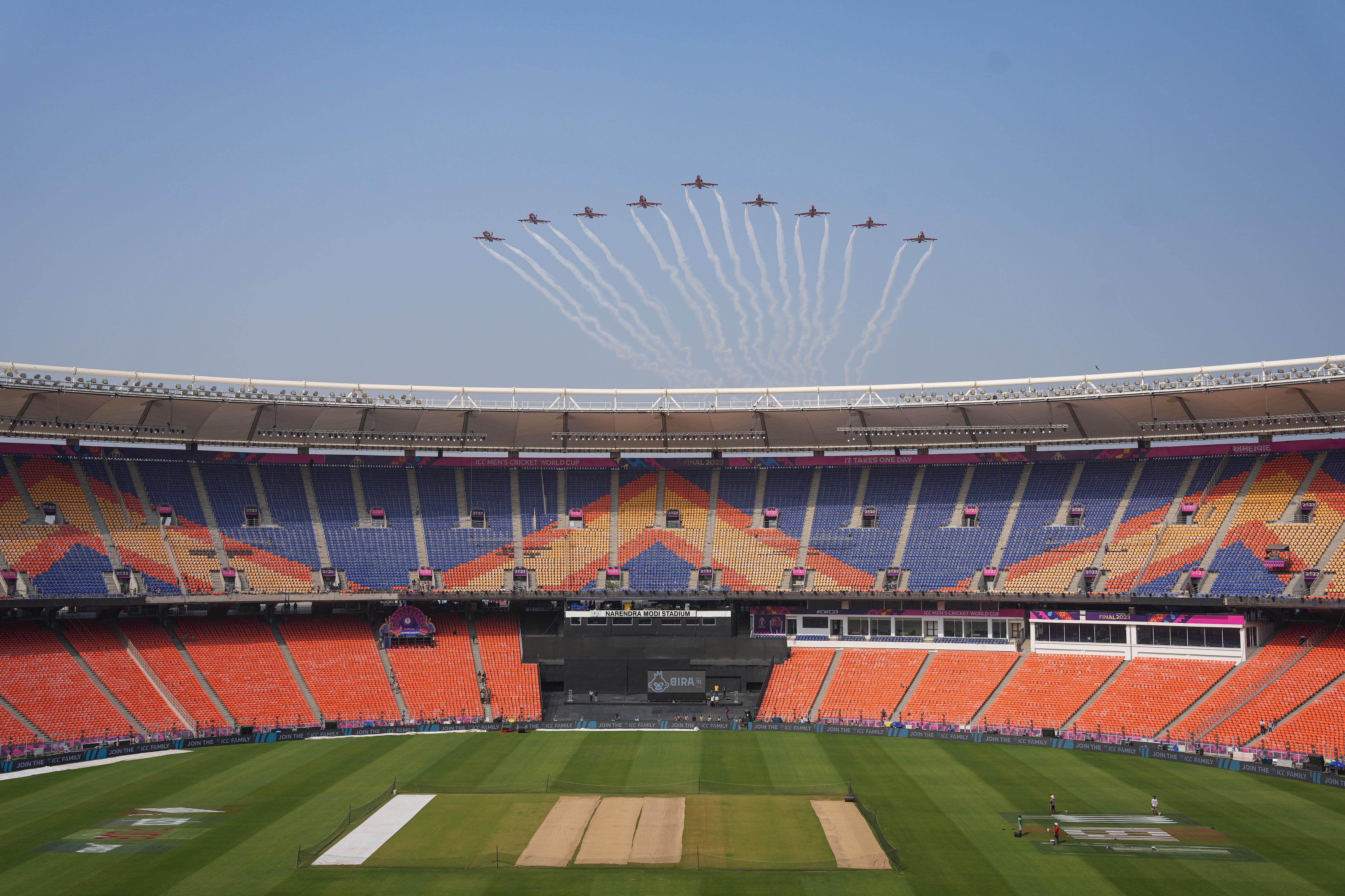 Indian Air Force’s Surya Kiran Aerobatic Team does a flypastduring a rehearsal ahead of the WC final. PTI