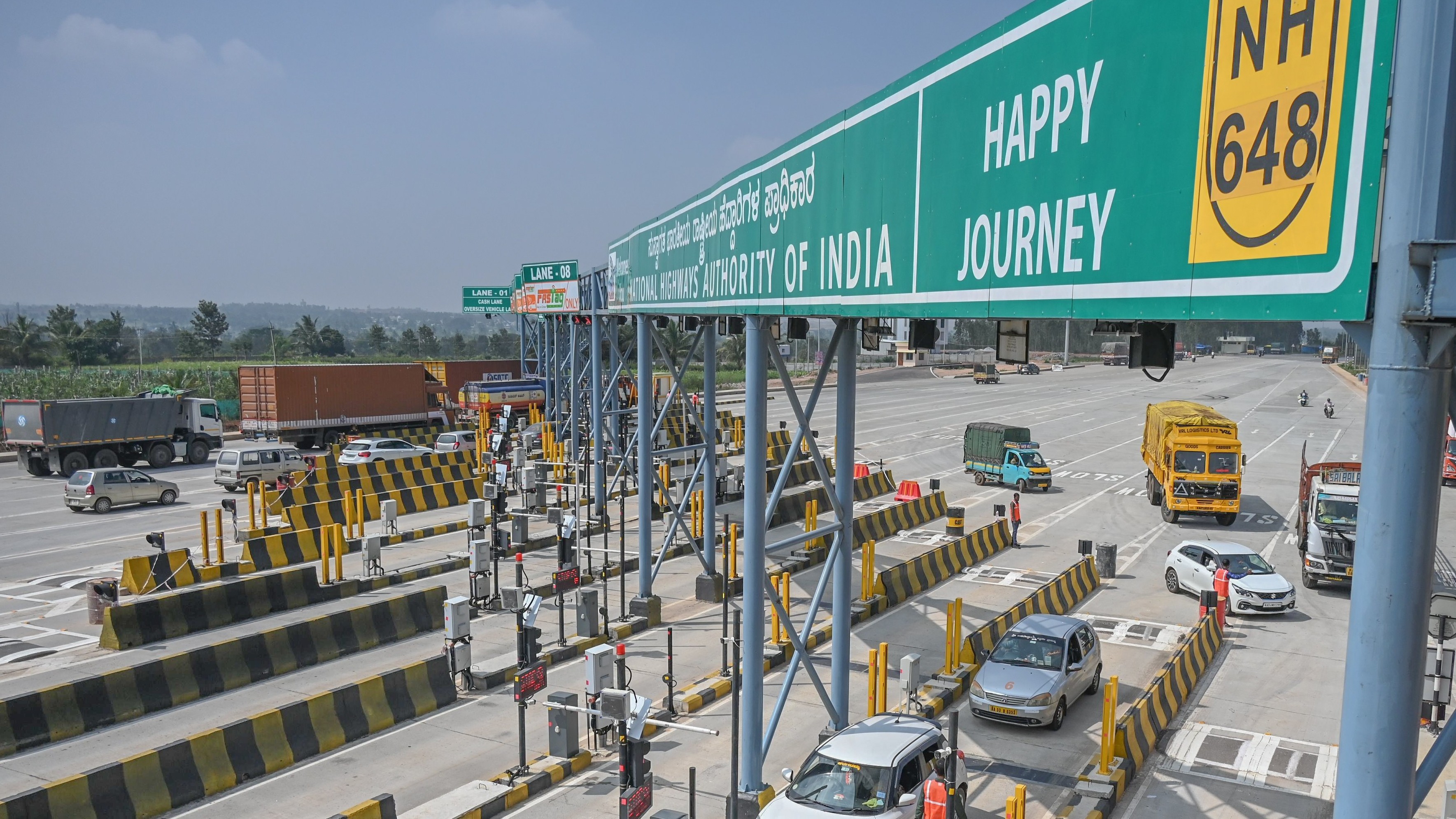 Karnataka Toll Price Hike April 2026 Vehicles passing through Karnataka highway toll plaza after April 2026 toll price hike