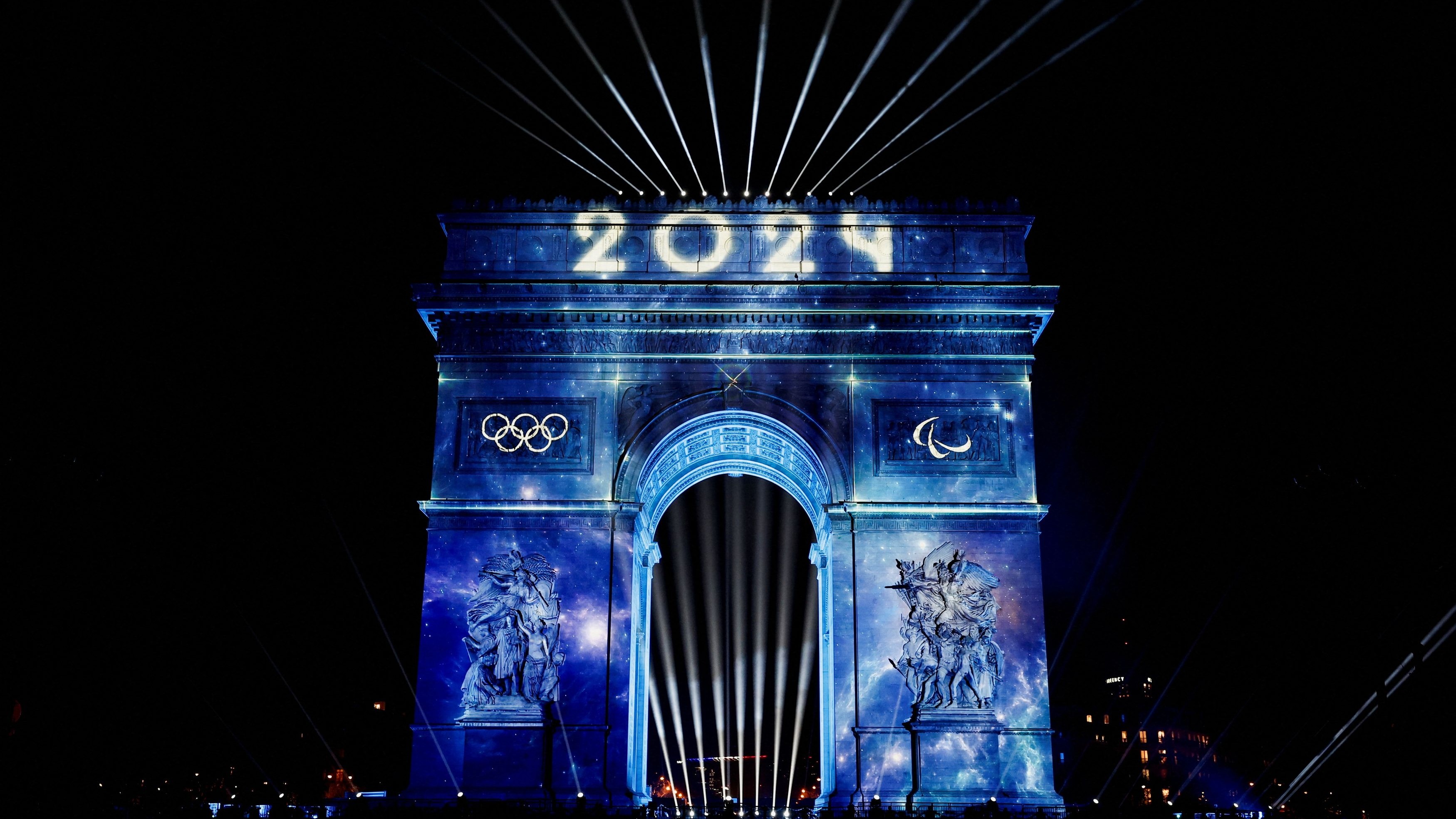 "2024" is projected onto the Arc de Triomphe to celebrate the entry into the Olympic year, during the New Year's celebrations on the Champs Elysees avenue in Paris, France, January 1, 2024. REUTERS/Benoit Tessier