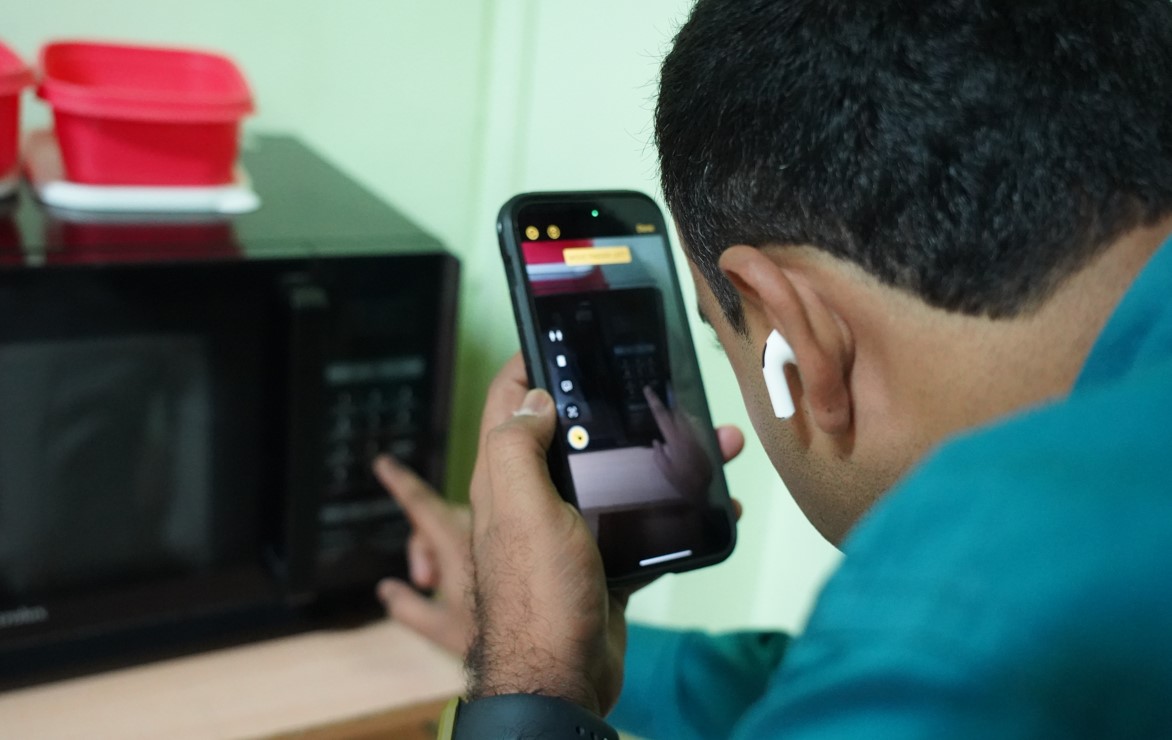 Moses Chowdari Gorrepati using Detection mode on Magnifier feature of his iPhone.
