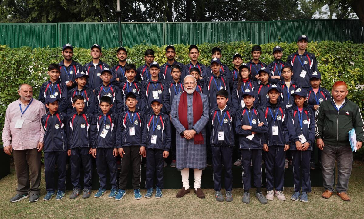 Prime Minister Narendra Modi with students from Jammu and Kashmir, in New Delhi, Sunday, Dec. 24, 2023.