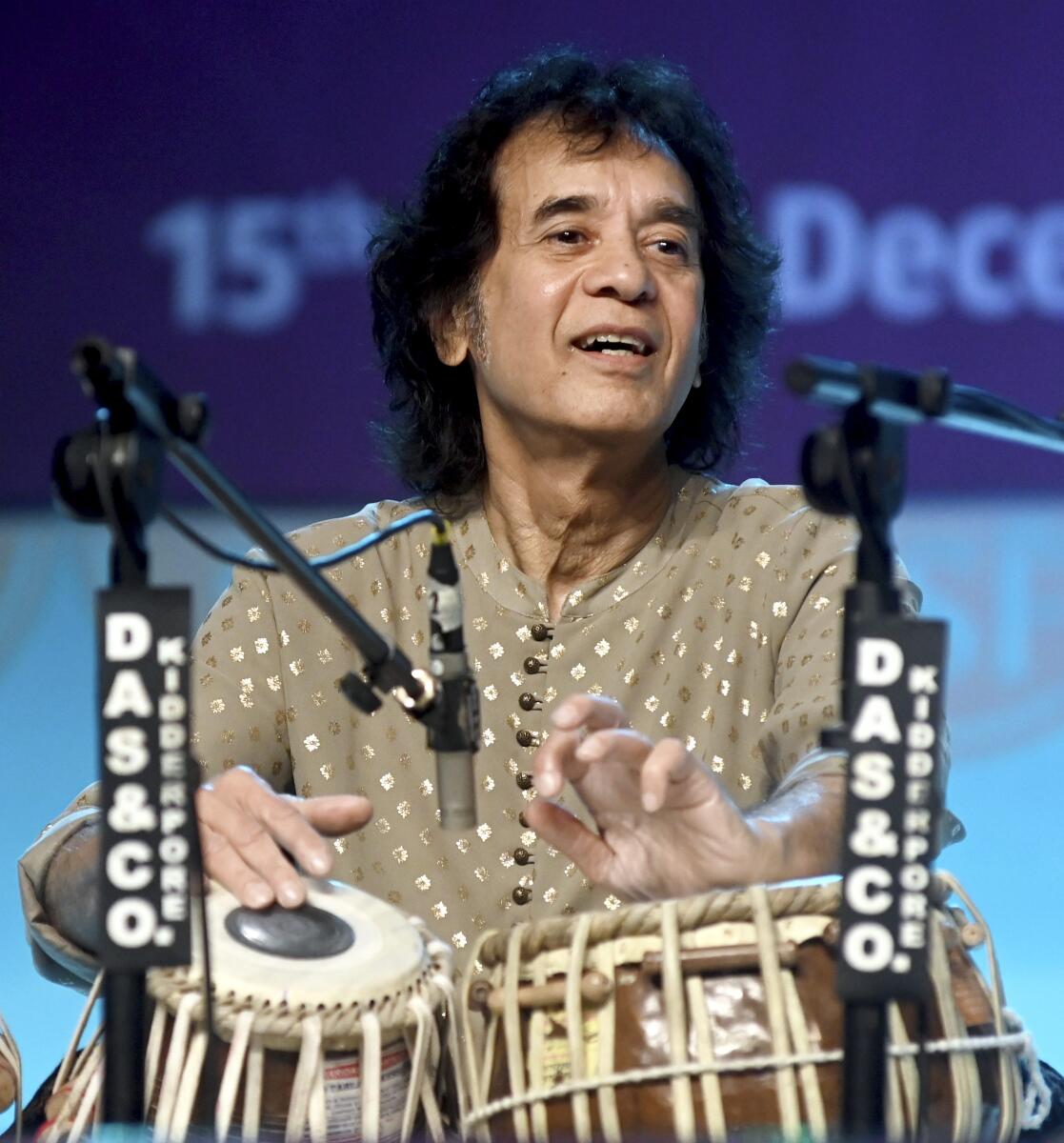 Indian tabla legend Ustad Zakir Hussain performs at the 'Swara Samrat Festival 2023-24', in Kolkata.