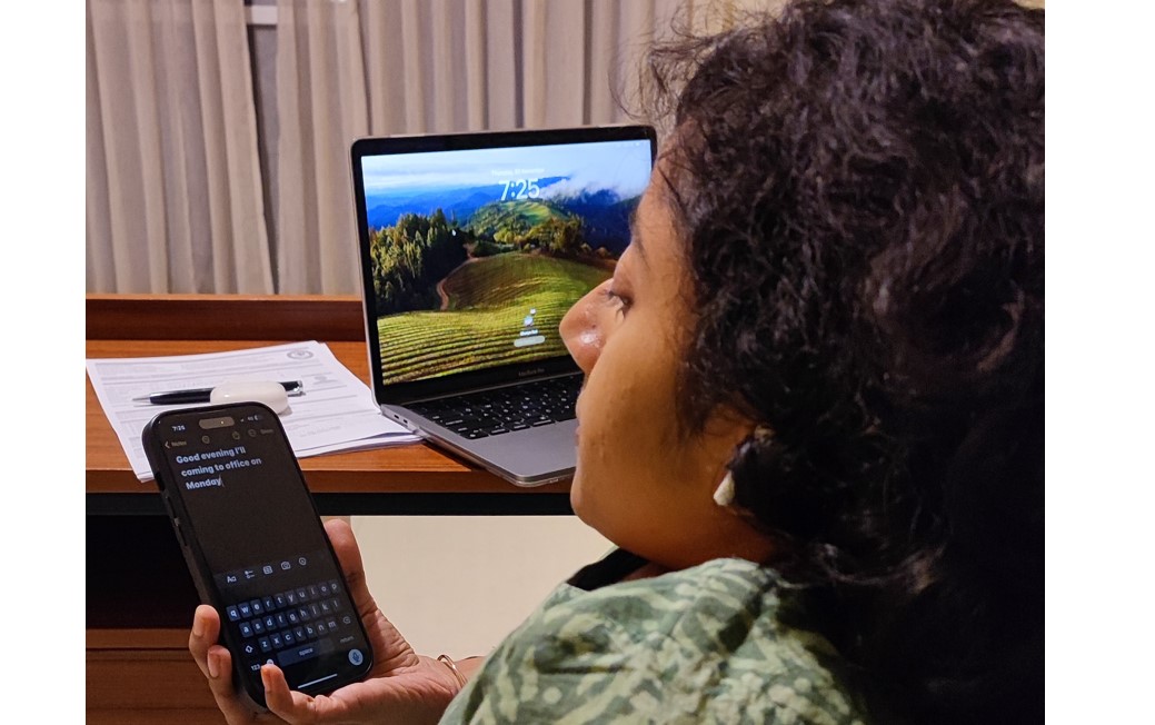 Dhanya Ravi using the voice control feature to dictate message.