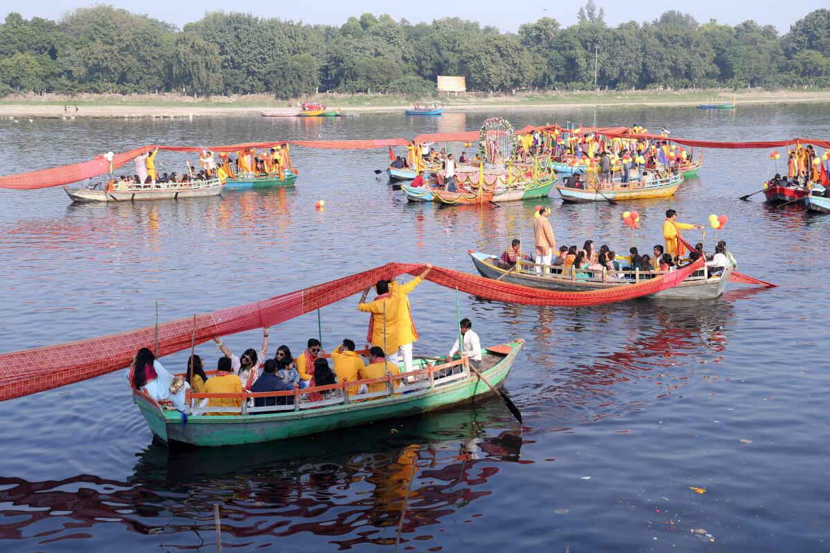 Devotees perform 'Chunari Manorath' ritual of the Yamuna river, in Mathura.
