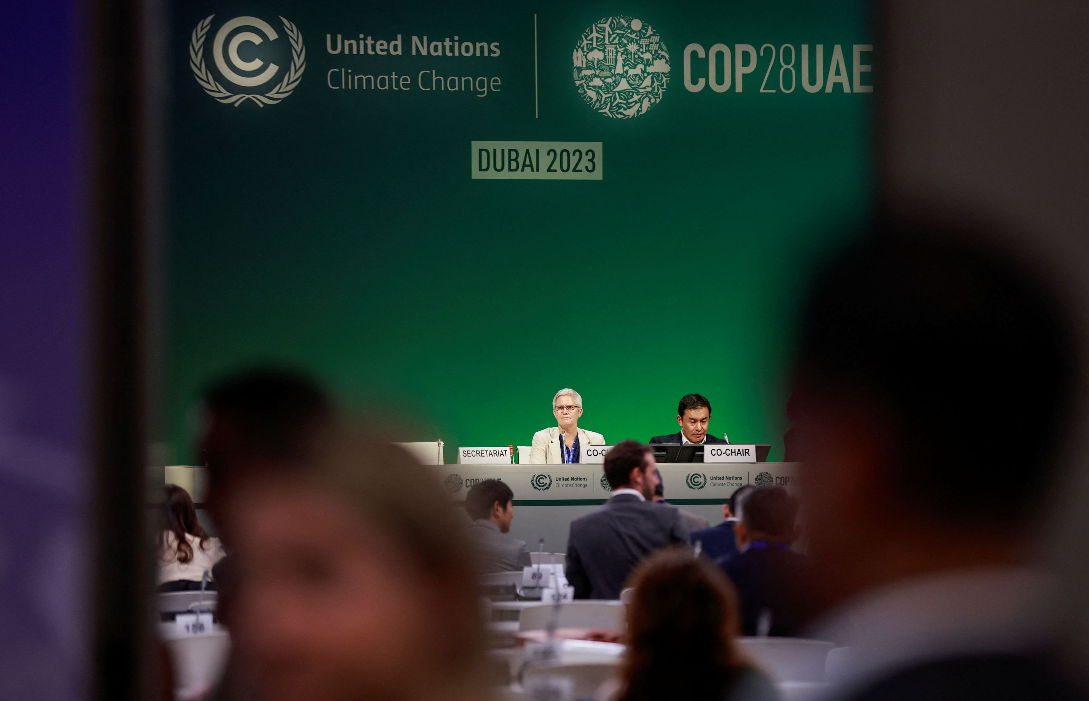 Delegates meet on the day of COP28 draft deal negotiations, during the United Nations Climate Change Conference (COP28) in Dubai, United Arab Emirates.