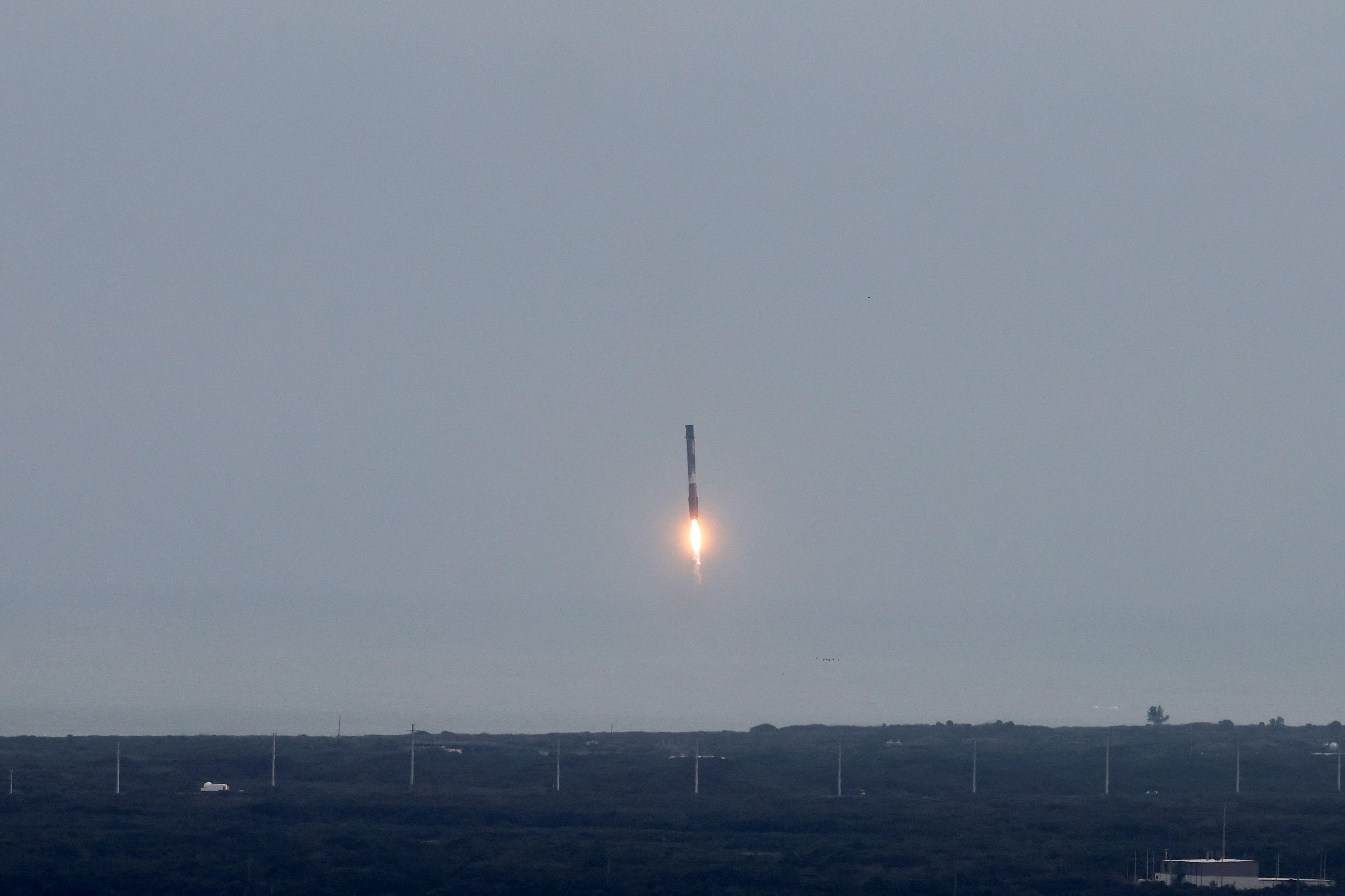 The booster for Axiom Mission 3 is pictured on the day of its launch to the International Space Station with crew members Commander Michael Lopez-Alegria of the U.S./Spain, Pilot Walter Villadei of Italy, Mission Specialist Alper Gezeravci of Turkey, and ESA (European Space Agency) project astronaut Marcus Wandt of Sweden, at Cape Canaveral, Florida.