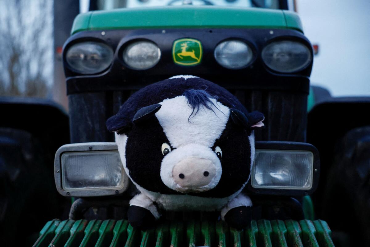 A stuffed toy sits on a tractor blocking a highway during a protest over price pressures, taxes and green regulation, grievances shared by farmers across Europe, in Chennevieres-les-Louvres, near Paris, France, January 29, 2024.