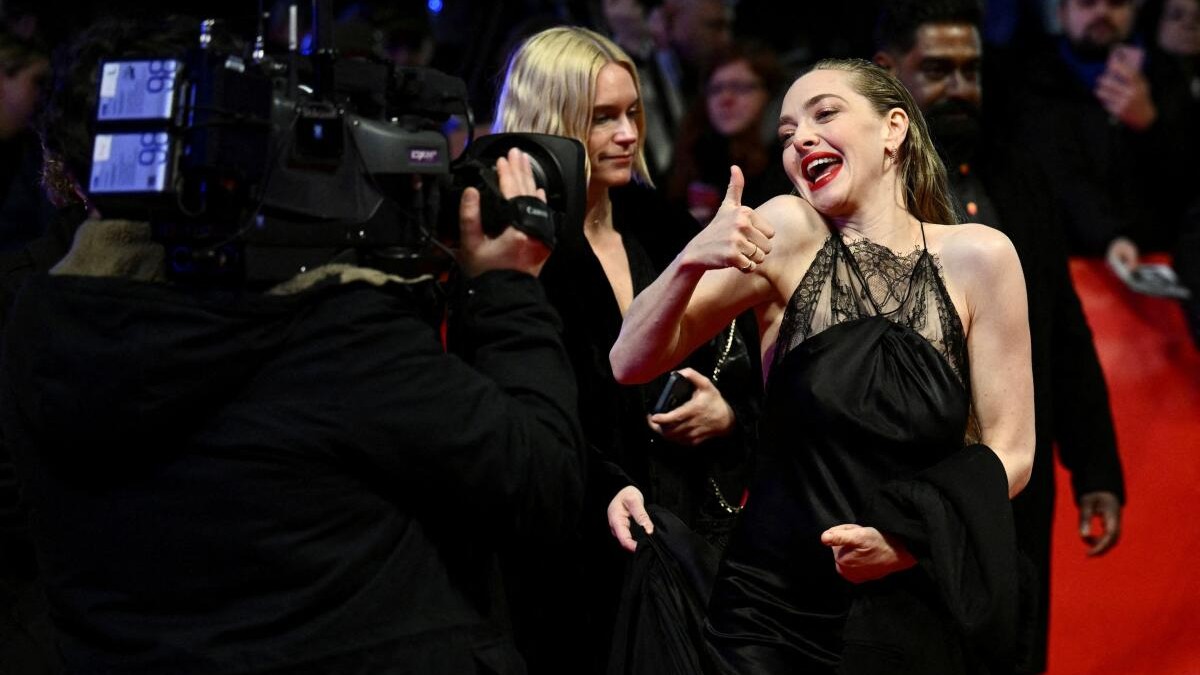 Cast members Amanda Seyfried gestures as she attends the screening of the movie 'Seven Veils' at the 74th Berlinale International Film Festival in Berlin.