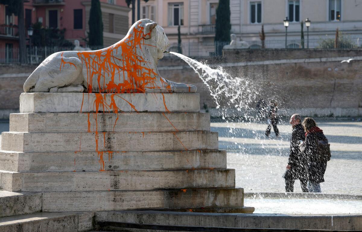 Animal rights activists deface Rome's Fountain of Lions known as "Fontana dei Leoni" in Piazza del Popolo in Rome, February 1, 2024.