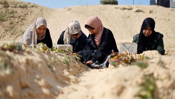 Palestinians visit a cemetery, amid the ongoing conflict between Israel and the Palestinian Islamist group Hamas, in Rafah in the southern Gaza Strip, February 26, 2024.