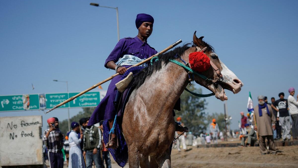 Indian farmers march towards New Delhi to press for better crop prices promised to them in 2021.