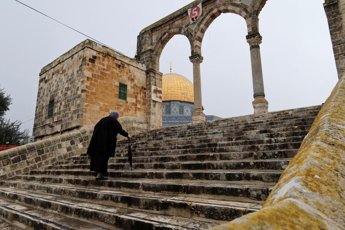 A Muslim worshipper walks ahead of Friday prayer in the al-Aqsa compound, also known to Jews as the Temple Mount, in Jerusalem's Old City February 2, 2024.