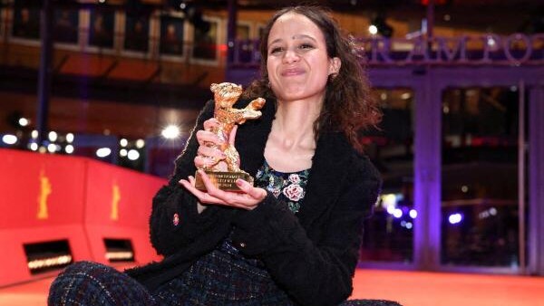 Director Mati Diop poses with the Golden Bear for Best Film for 'Dahomey', after the award ceremony of the 74th Berlinale International Film Festival in Berlin, Germany.