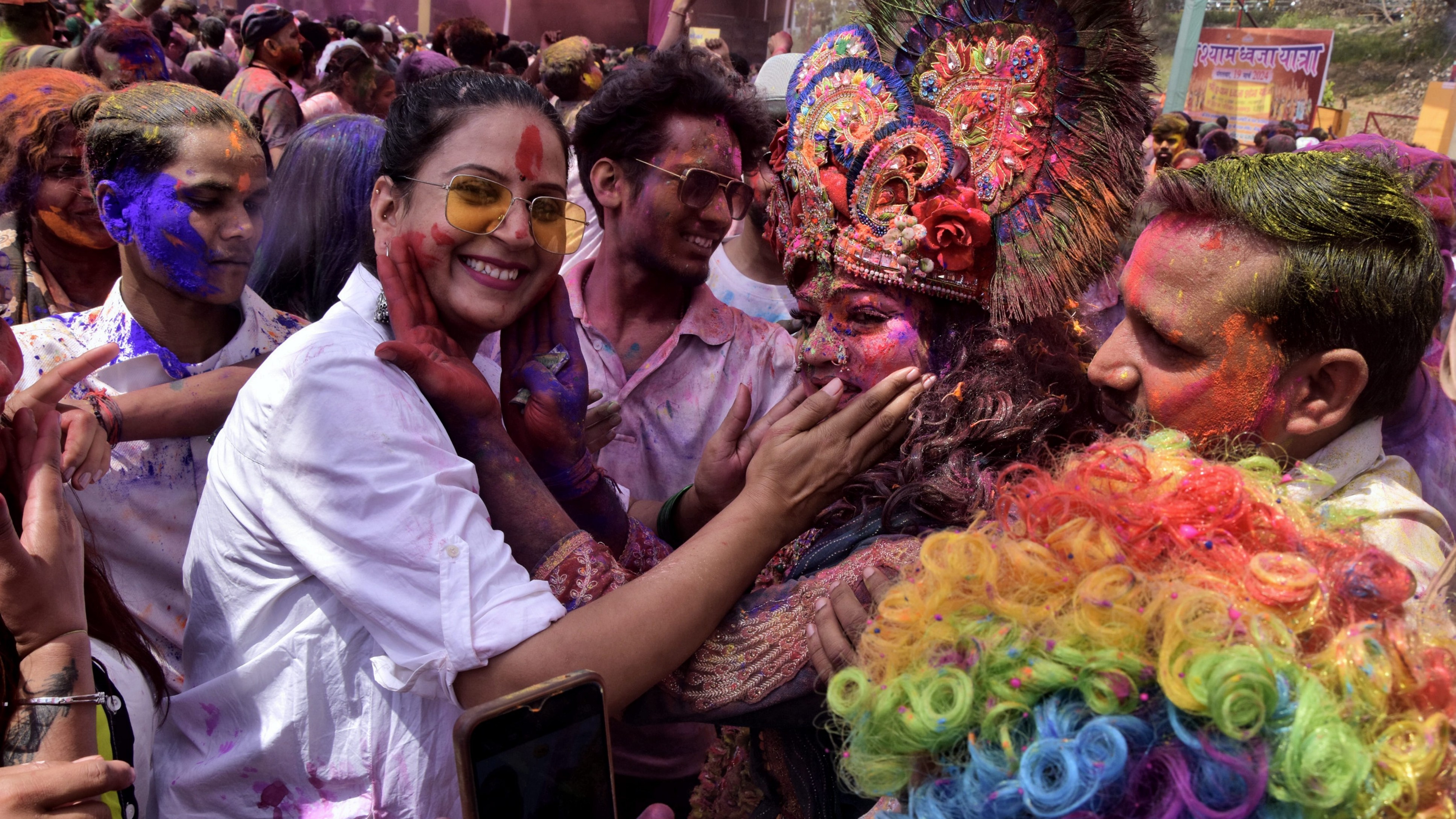 People play with colours during Holi festival celebrations, at Khatu Shyam temple in Lucknow.