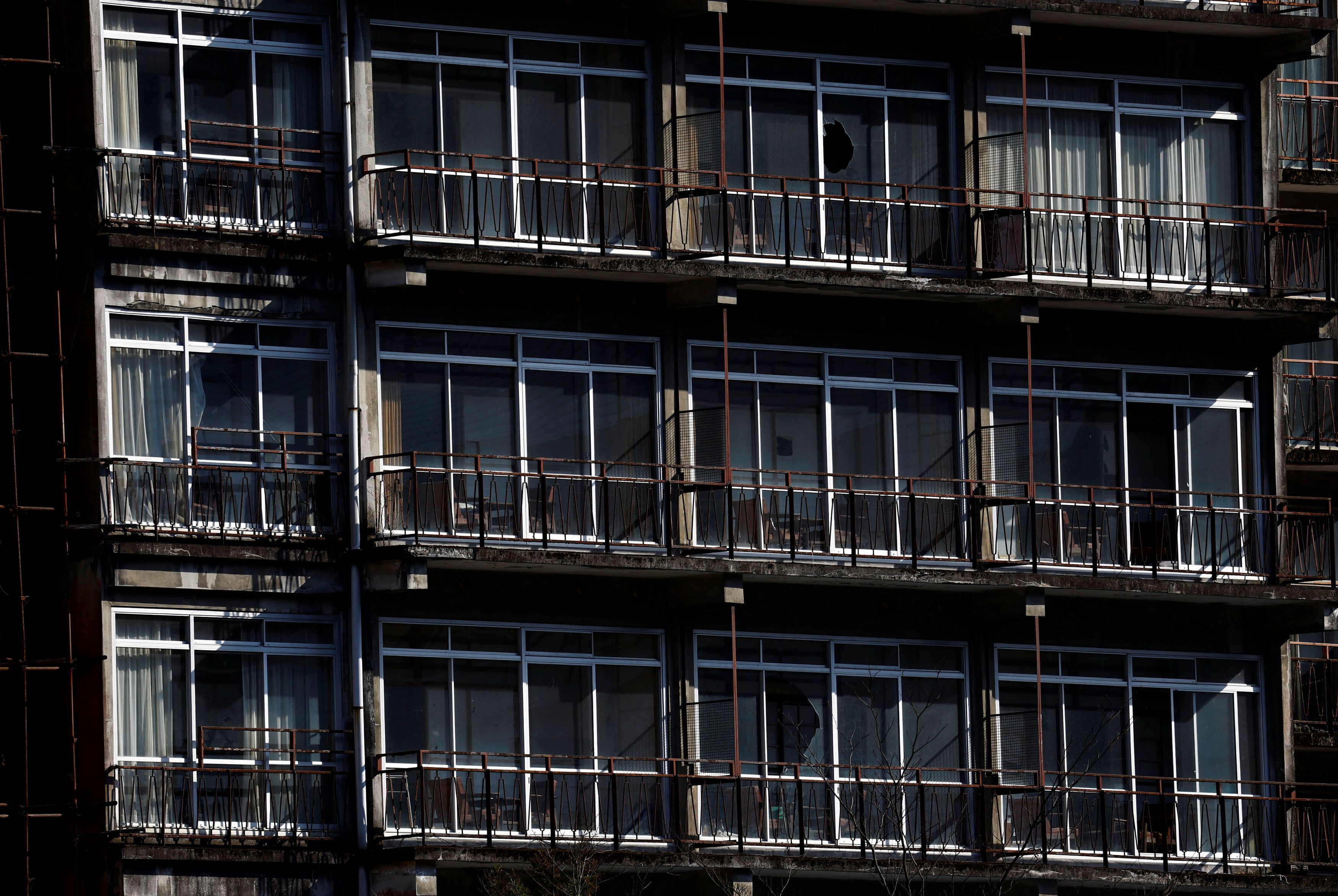 A view shows a derelict hotel or hot-spring inn, abandoned after the bubble economy burst in the early 1990s, along the Kinugawa River at Kinugawa Onsen hot-spring resort in Nikko, Tochigi prefecture, Japan March 15, 2024.  
