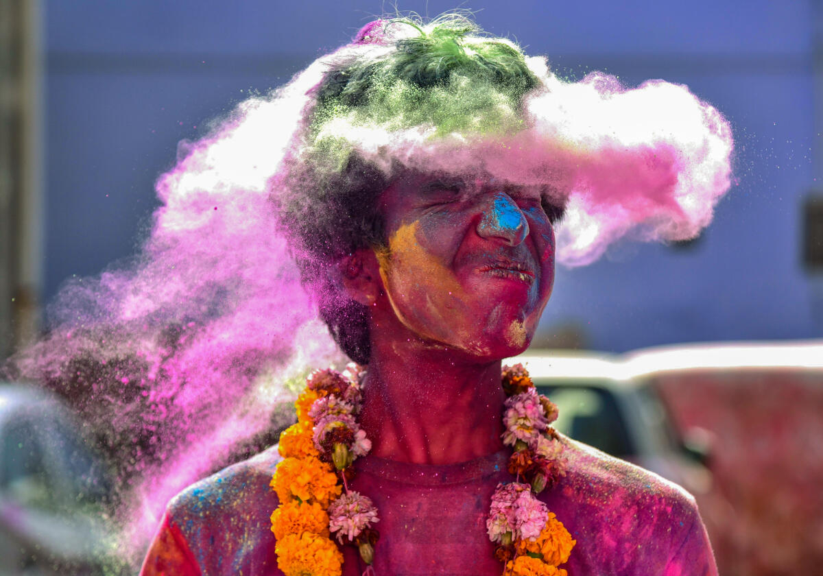 A woman participates in Holi celebrations in Bikaner.