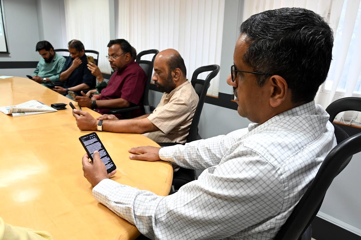 Seniors working in DH's Bengaluru office assembled for the evening pg1 meeting while others from different locations join in online