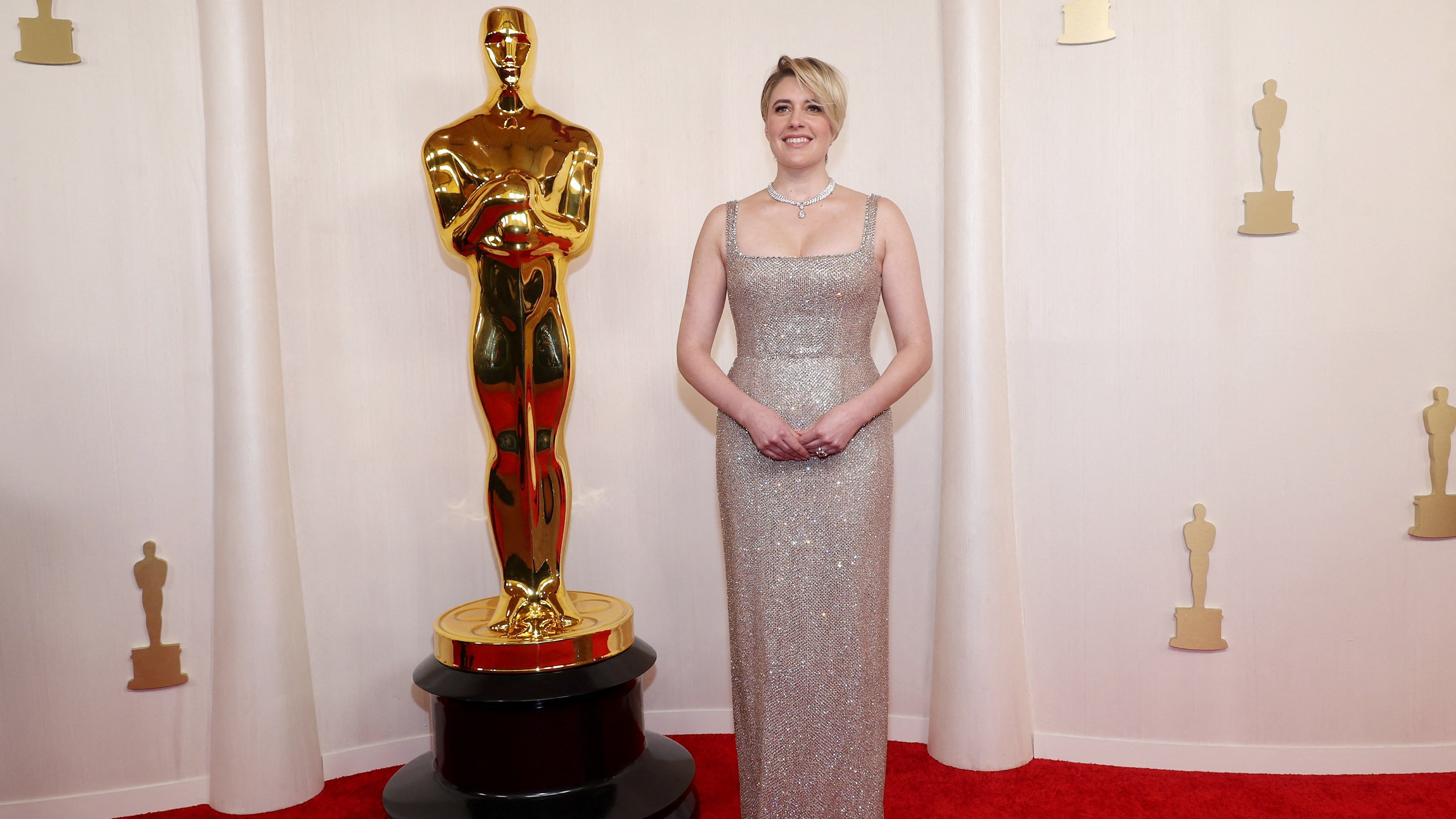 Greta Gerwig wowed everyone in a gold column dress.