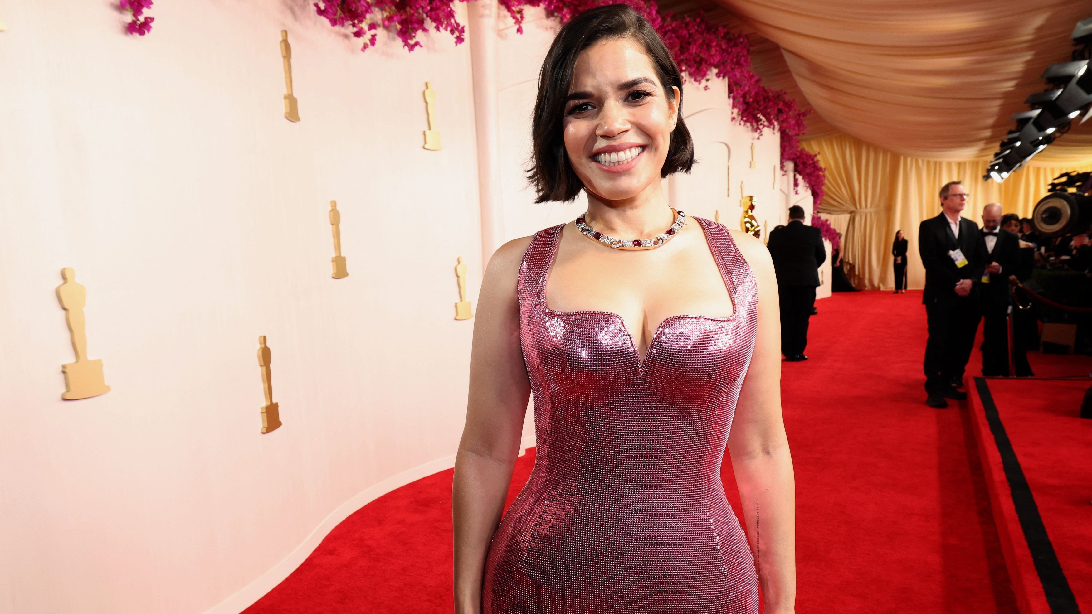 Barbie best-supporting actress nominee America Ferrera arrived in a sparkly pink form-fitting gown.