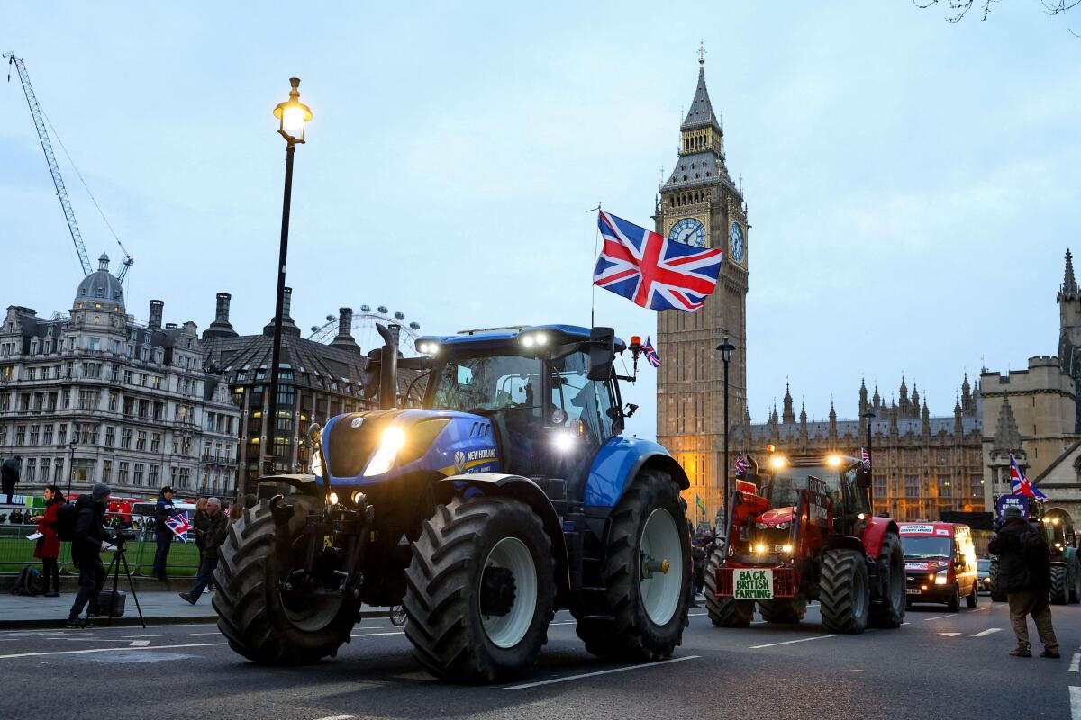 Farmers drive tractors through central London to protest against issues including food imports, as part of demonstrations from growers around the world, in London.