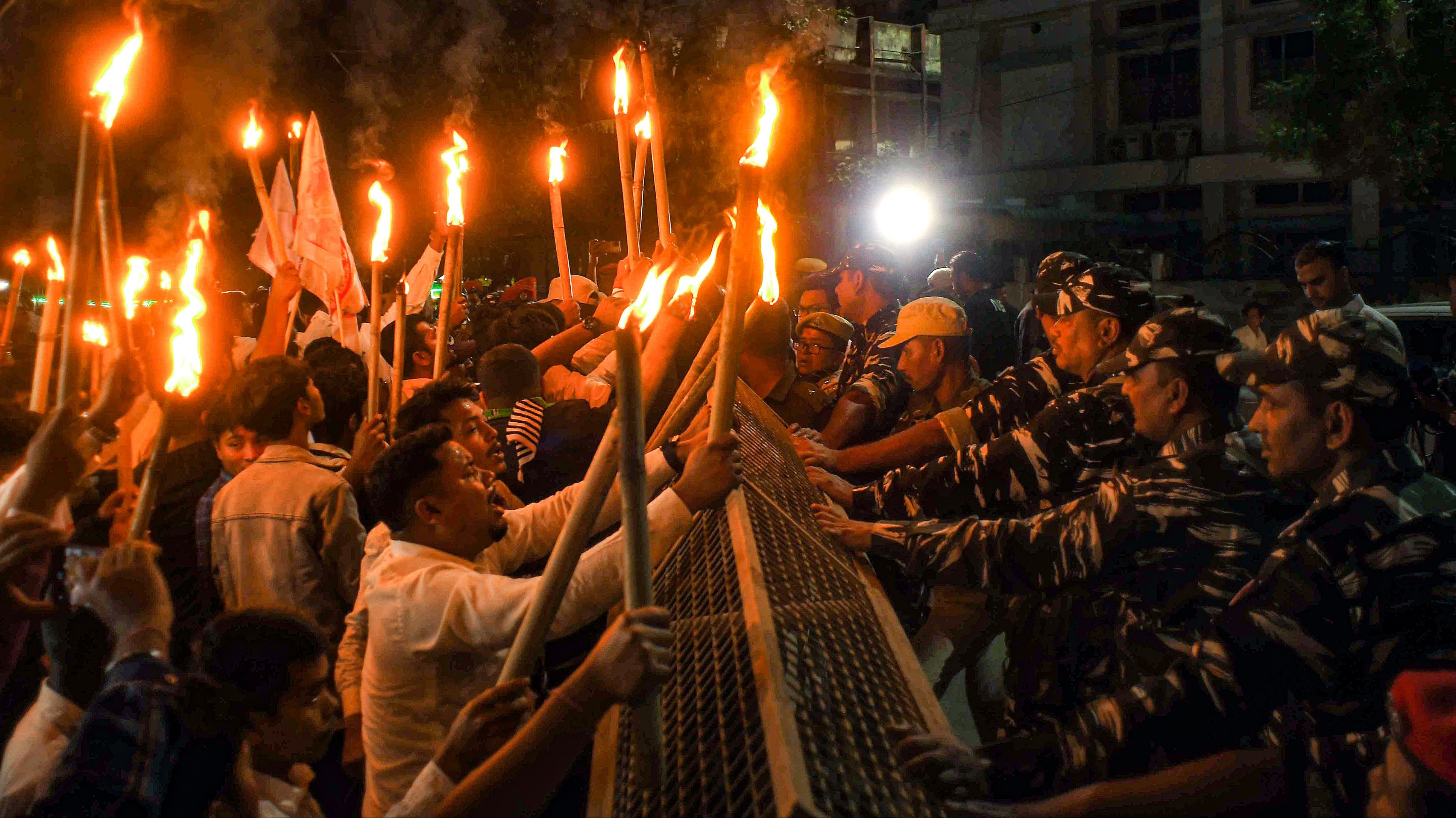 Security personnel try to stop activists of All Assam Students Union (AASU) during a protest march after the central government notified the rules for implementation of the Citizenship (Amendment) Act, in Nagaon, Assam.