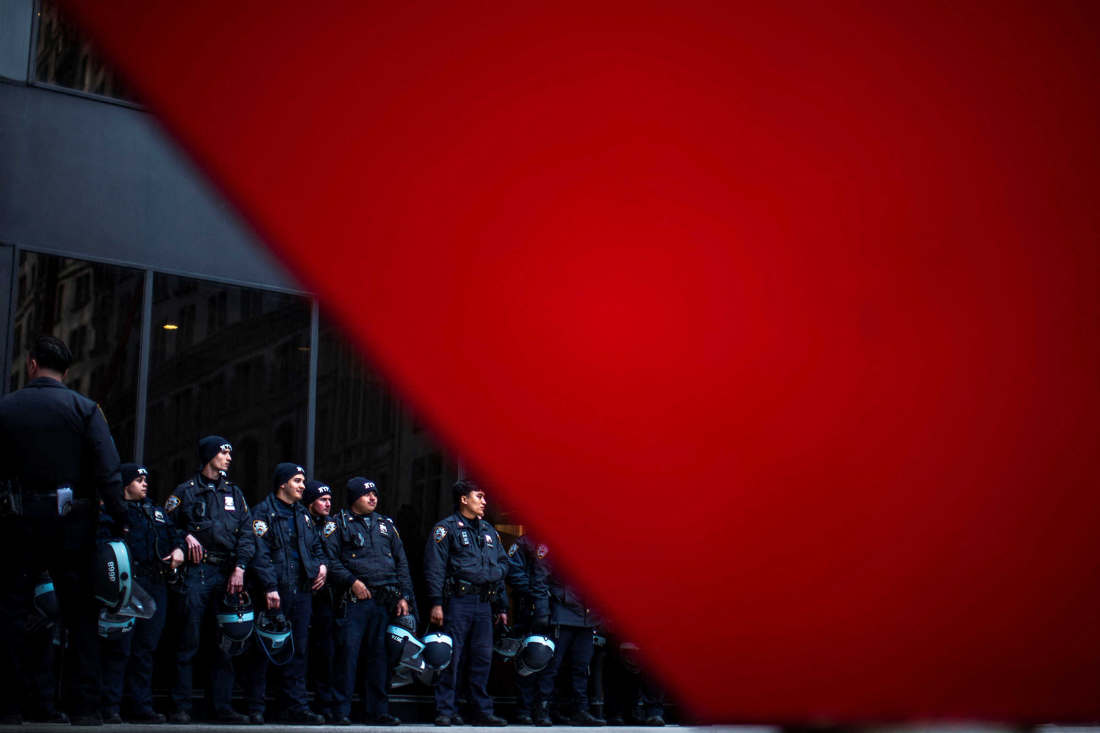 New York police officers stand guard as protesters march demanding a ceasefire and the end of Israeli attacks on Gaza, during the ongoing conflict between Israel and the Palestinian Islamist group Hamas, in New York City, U.S., March 19, 2024. 