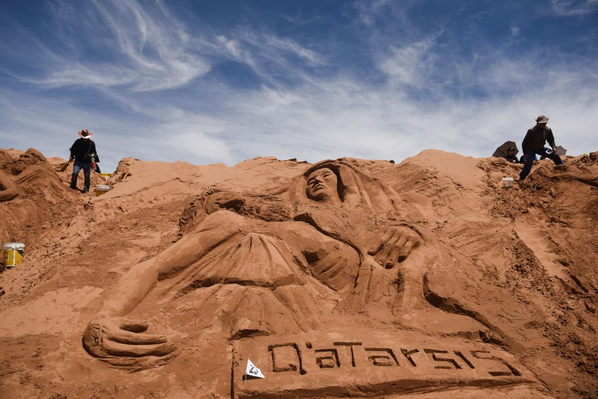 Bolivians commemorate Holy Week by sculpting surprising figures in the sand, in Oruro.