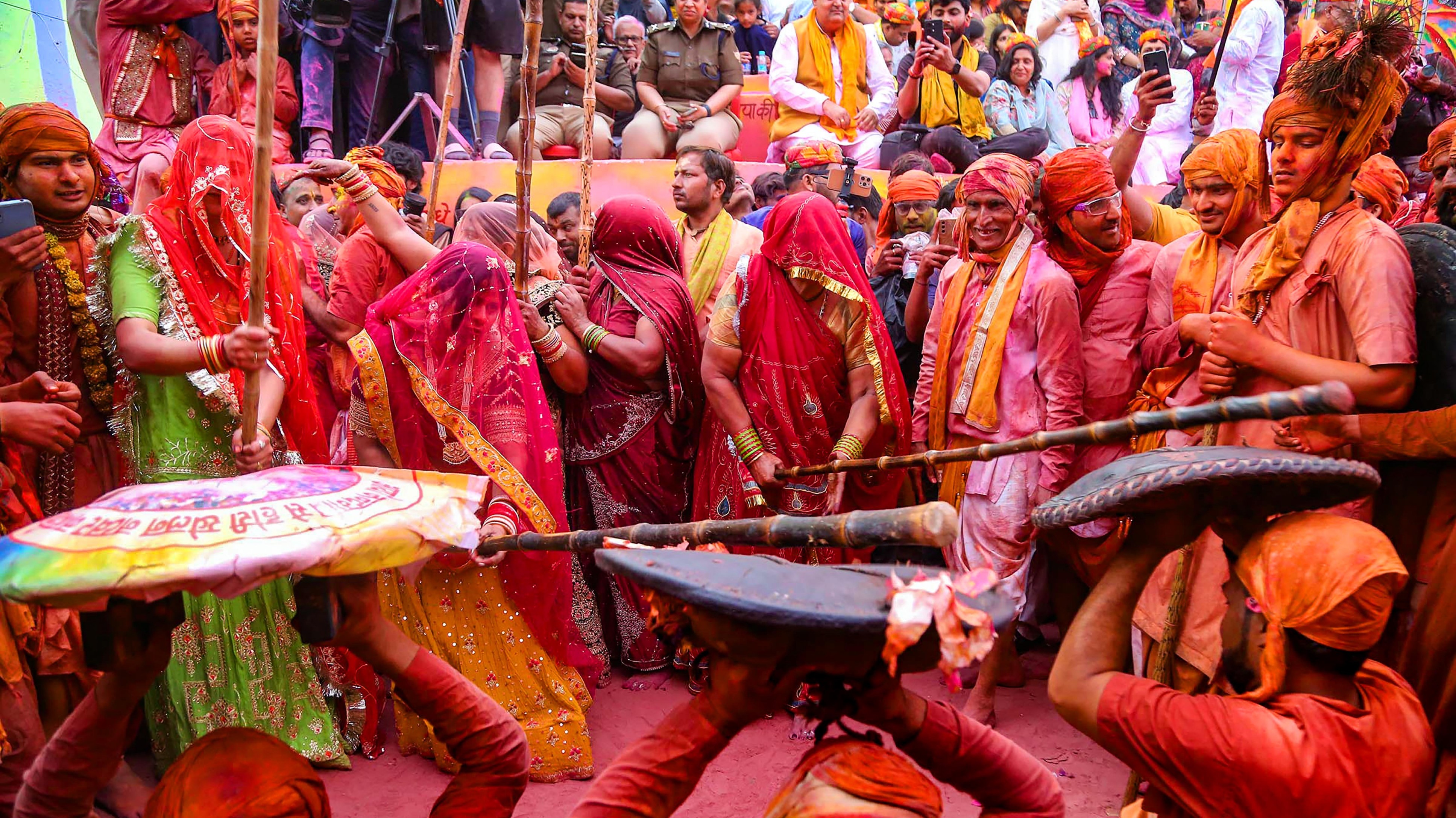 With joyful abandon, the women armed with sticks engaged welcomed men who playfully dodge and weave through the crowd.