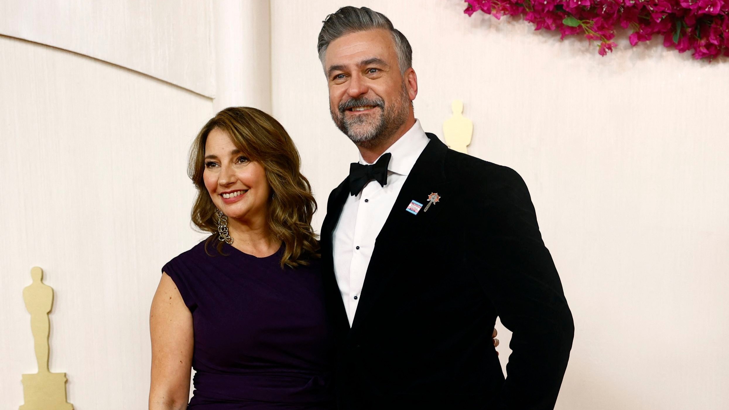 Nimona filmmaker Troy Quane also graced the Oscar 2024 red carpet sporting the red Artists4Ceasefire pin.