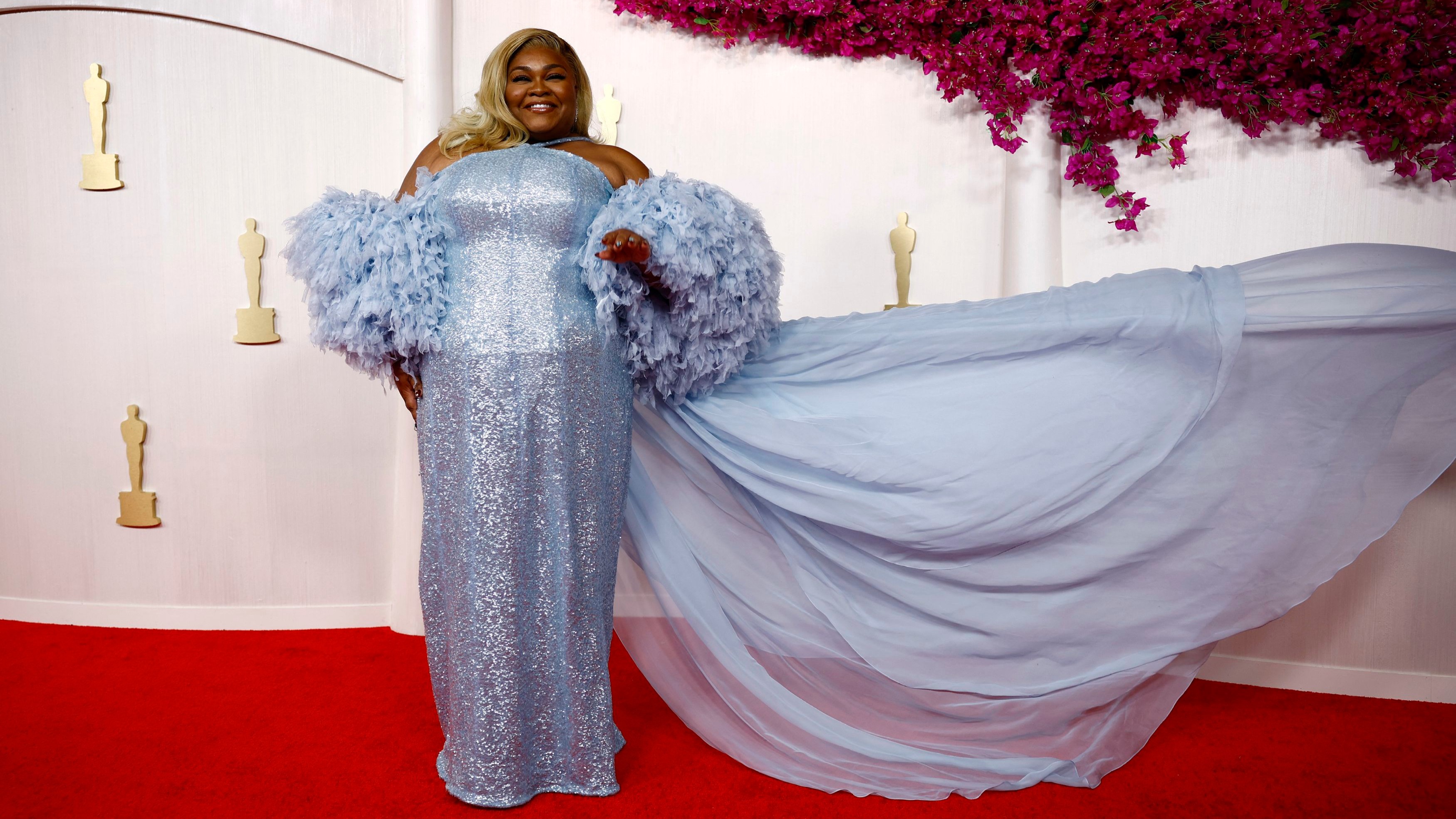 Da'Vine Joy Randolph, who won the best supporting actress Oscar for her role in The Holdovers, sparkled in a light blue gown with voluminous feathery sleeves.