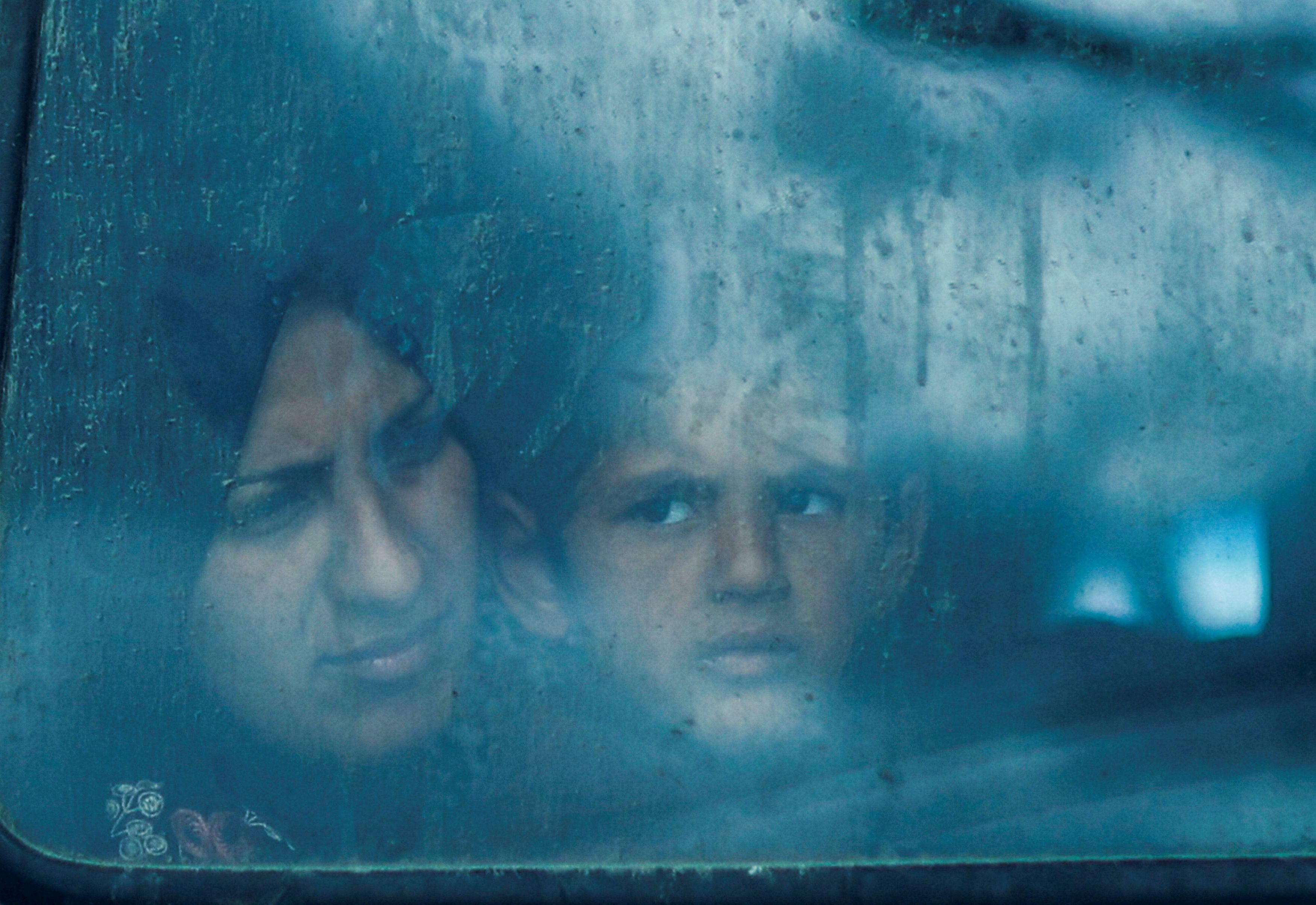 Displaced Palestinians look out from a bus window, amid the ongoing conflict between Israel and the Palestinian Islamist group Hamas, in Rafah, in the southern Gaza Strip March 9, 2024.