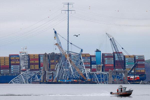 Wreckage of the Francis Scott Key bridge lies across the deck of the Dali cargo vessel as salvage work continues, in Baltimore, Maryland.