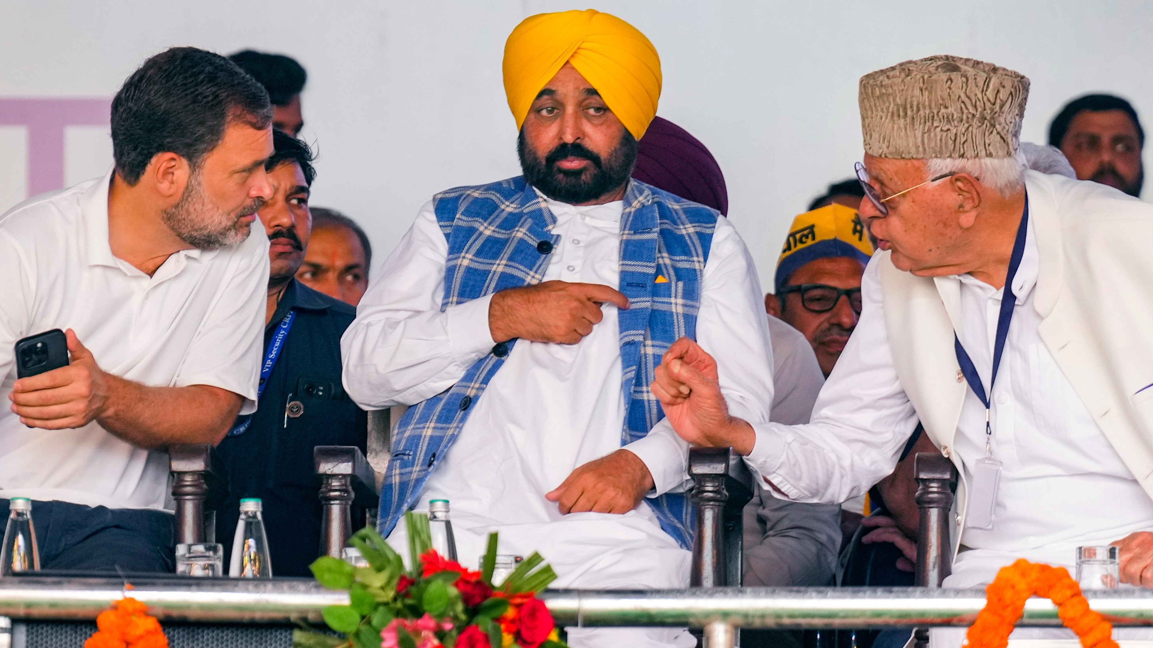 Congress leader Rahul Gandhi seen in a conversation with Punjab Chief Minister Bhagwant Mann and J&amp;K NC chief Farooq Abdullah during I.N.D.I.A. bloc's 'Loktantra Bachao Rally' at Ramlila Maidan.