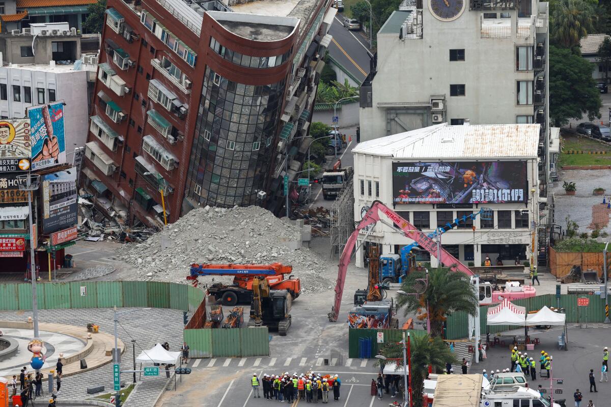 People take part in a ceremony ahead of the demolition of a damaged building, following the earthquake, in Hualien, Taiwan April 5, 2024. 
