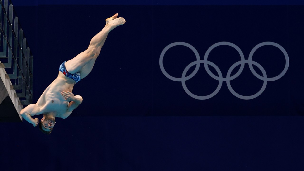 French faux pas: Olympics diver takes tumble during inauguration ceremony in Paris